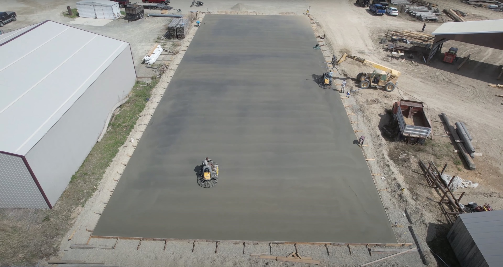 Large commercial concrete slab installation with professional equipment