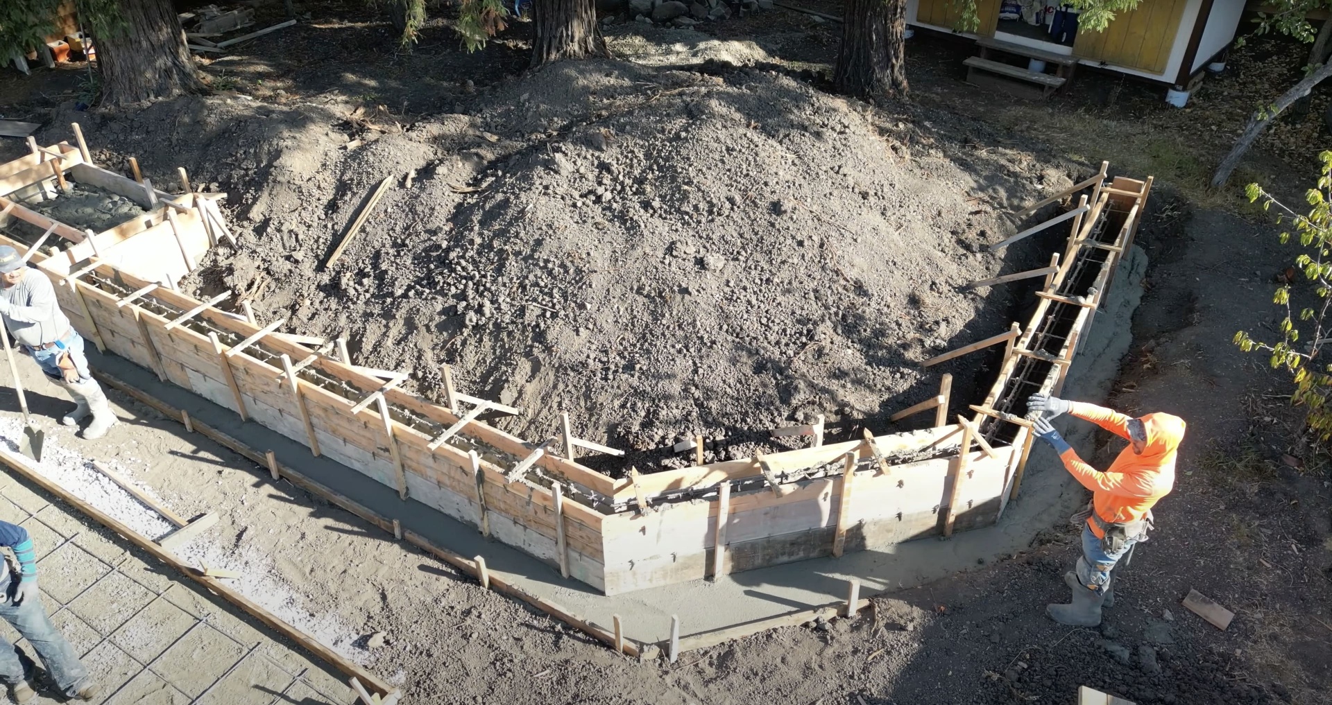 Concrete foundation preparation with wooden forms and rebar reinforcement