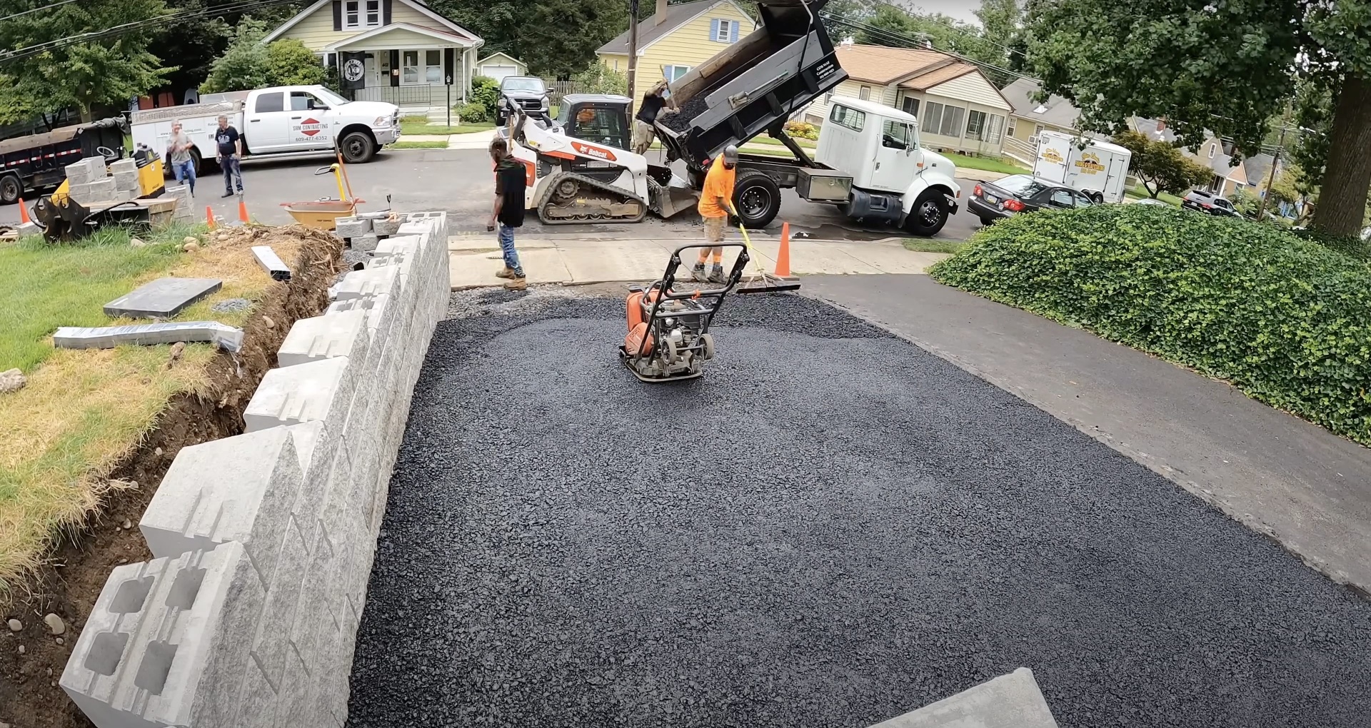 Asphalt and concrete street repair work with professional crew and equipment