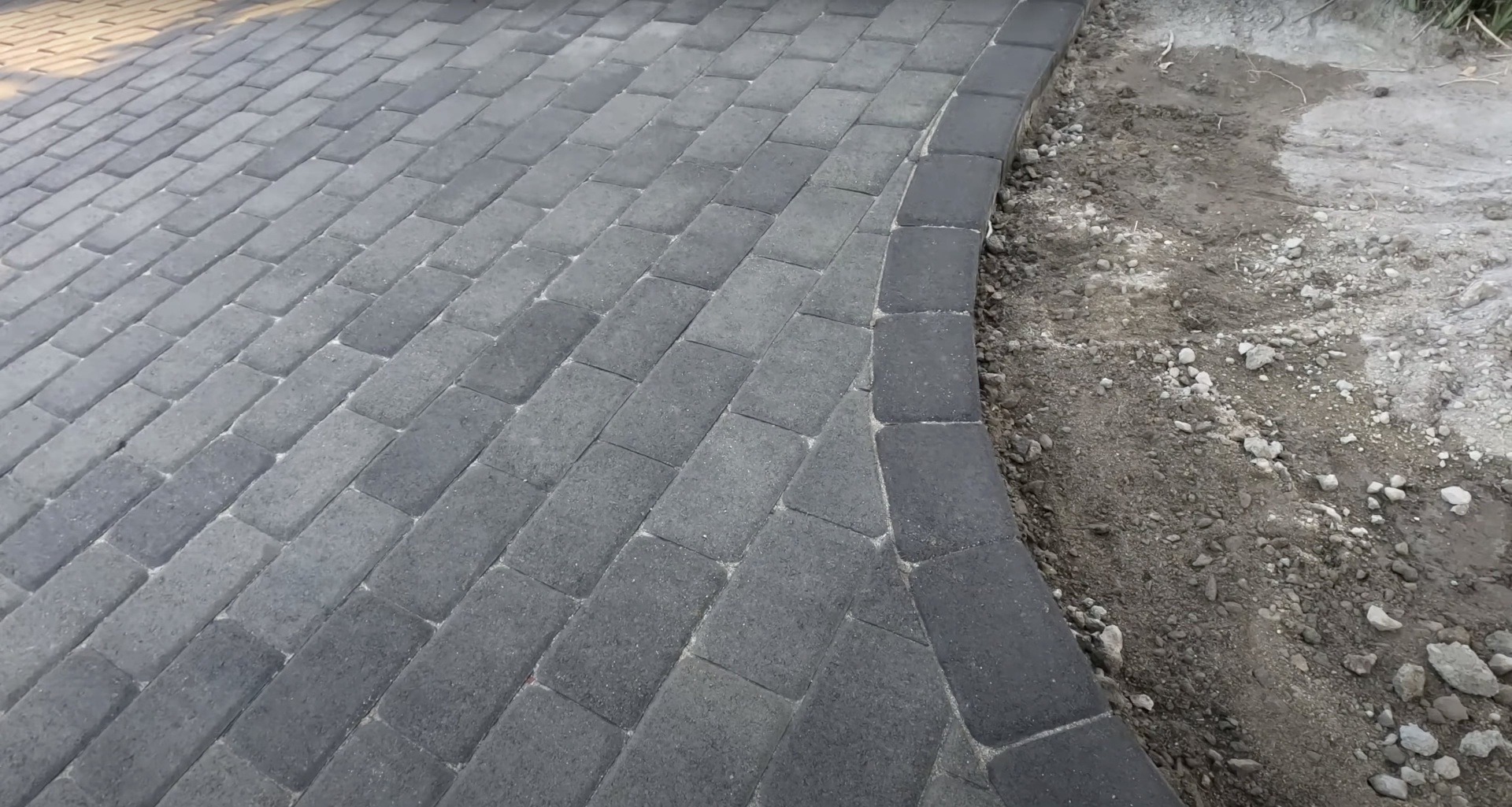 Concrete paver installation showing professional paving work in progress